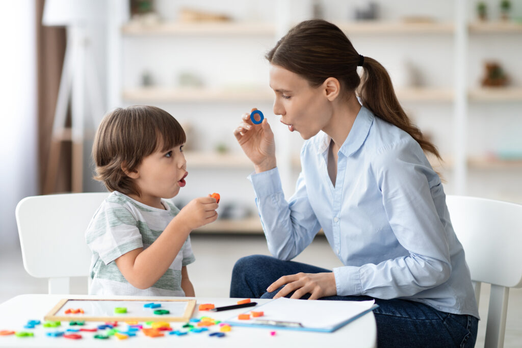 Child playing with therapist